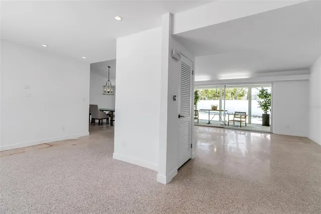 a kitchen with a refrigerator and a sink