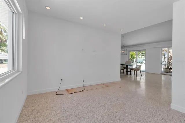 a kitchen with stainless steel appliances granite countertop a sink a stove and a microwave