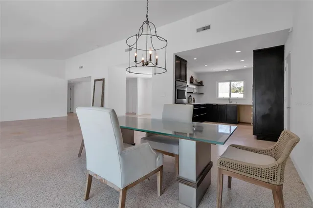 a view of a big room with windows and cabinet