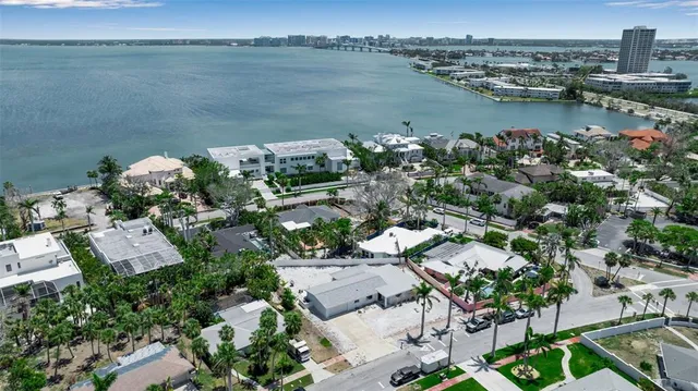 an aerial view of ocean with residential house with outdoor space