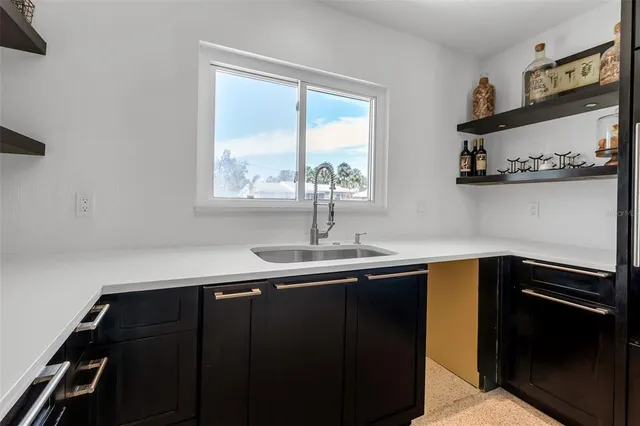 a view of an empty room and a window