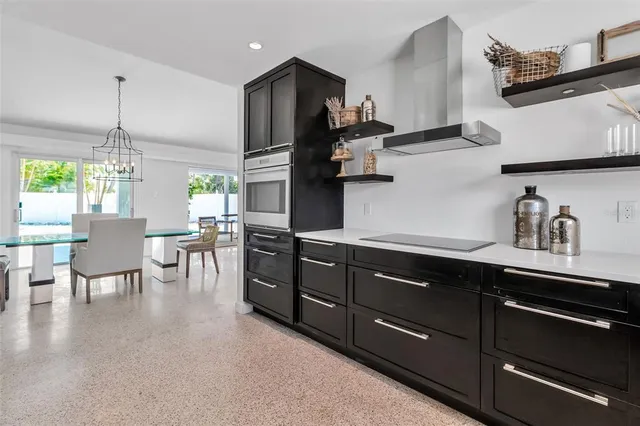 a view of an empty room with windows