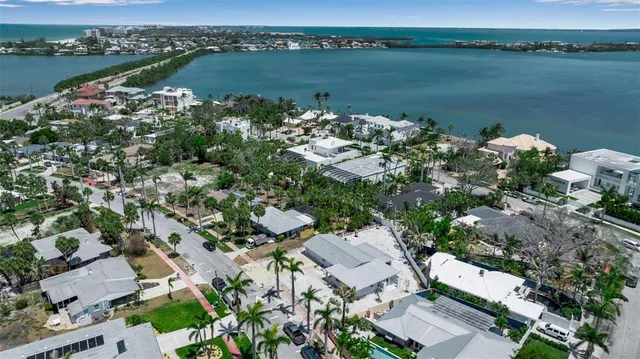 an aerial view of a house with a lake view