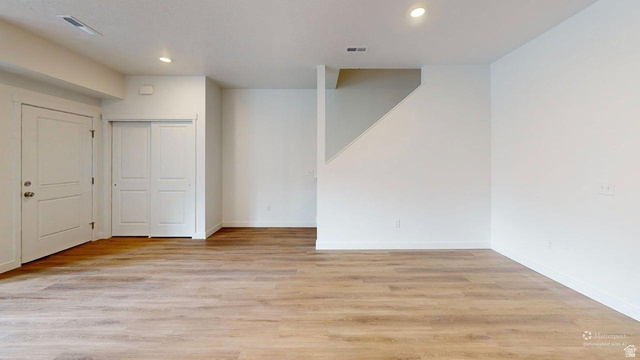 777 Pheasantbrook Drive, Unit 2B Centerville, UT 84014 - Photo 4 of 42 Open-concept room featuring wood-finish flooring, white walls, and recessed lighting