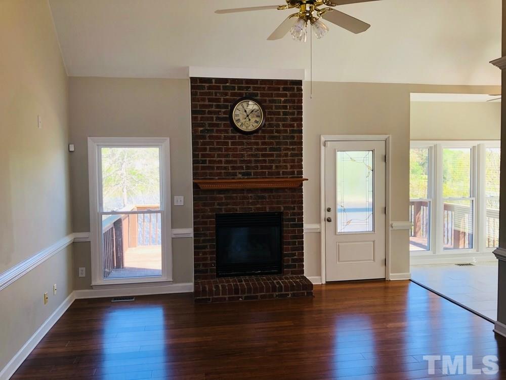 4309 Willow Lake Road Raleigh, NC 27616 - Photo 11 of 30 a living room with furniture and a fireplace