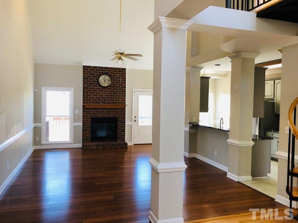 4309 Willow Lake Road Raleigh, NC 27616 - Photo 12 of 30 a view of a hallway view with wooden floor and a fireplace