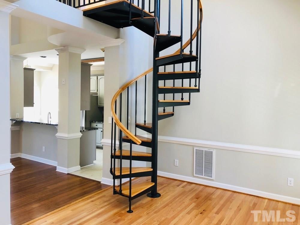 4309 Willow Lake Road Raleigh, NC 27616 - Photo 14 of 30 a view of entryway with wooden floor and stairs