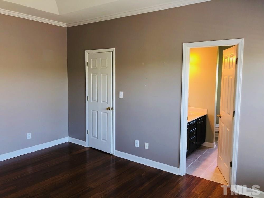4309 Willow Lake Road Raleigh, NC 27616 - Photo 19 of 30 an empty room with wooden floor and closet
