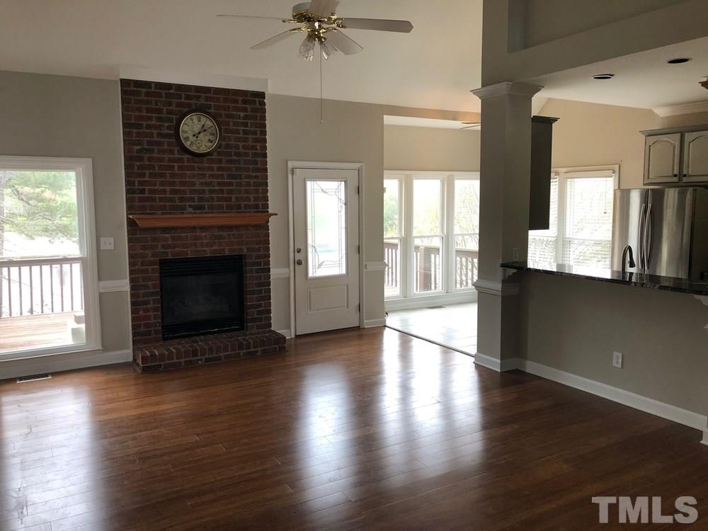 4309 Willow Lake Road Raleigh, NC 27616 - Photo 3 of 30 a view of an empty room with wooden floor and a window