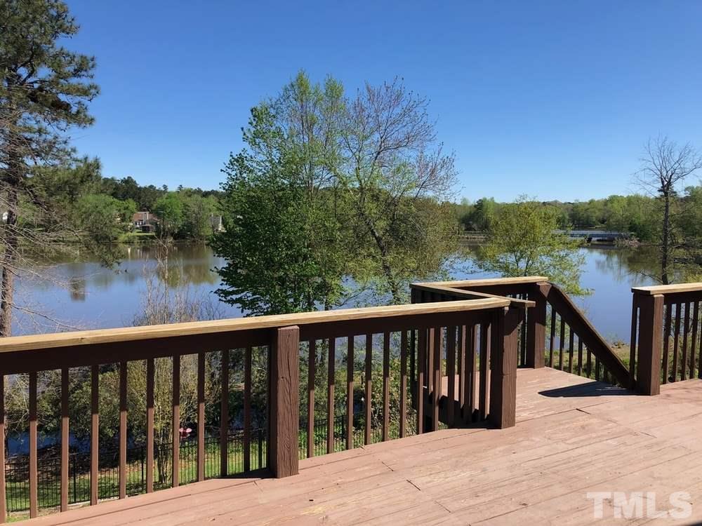 4309 Willow Lake Road Raleigh, NC 27616 - Photo 27 of 30 a view of a wooden balcony and outdoor space