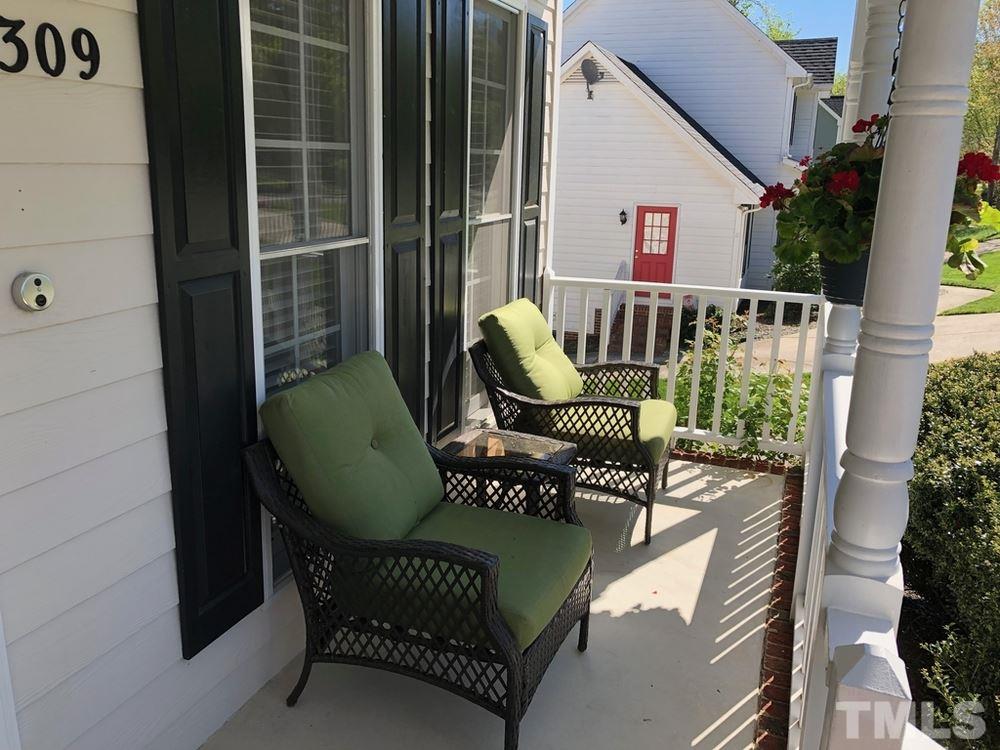 4309 Willow Lake Road Raleigh, NC 27616 - Photo 30 of 30 a balcony with table and chairs
