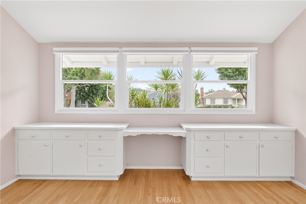 1005 West 20th Street Santa Ana, CA 92706 - Photo 17 of 28 Corner bedroom with built-ins featuring drawers and desk with scalloped design