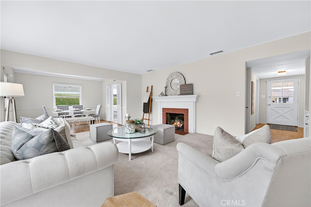 1005 West 20th Street Santa Ana, CA 92706 - Photo 3 of 28 View from corner of the living room with view of the fireplace and entry