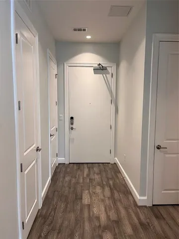 a view of room with wooden floor