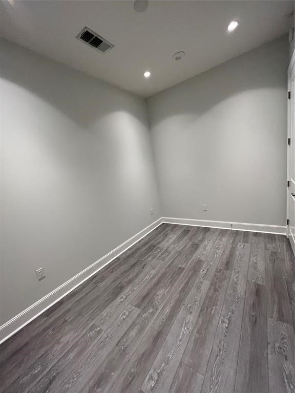 1211 Caroline Street, Unit 1708 Houston, TX 77002 - Photo 16 of 30 a view of room with wooden floor