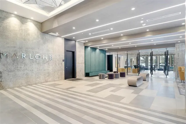 a view of a lobby with furniture and chandelier