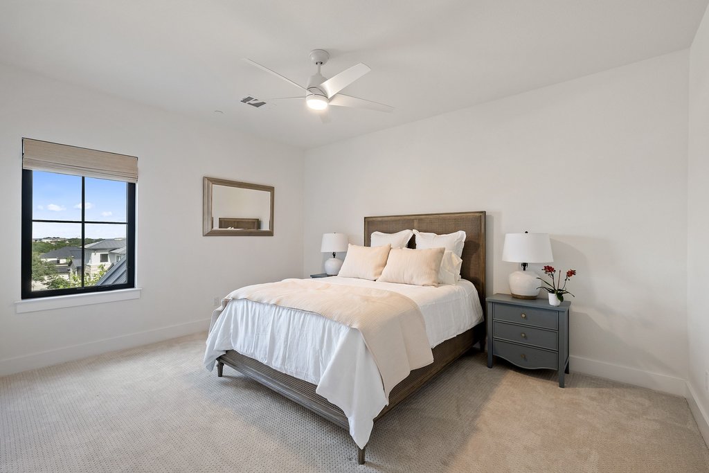 7516 Davenport Divide Road Austin, TX 78738 - Photo 27 of 40 Bedroom 3 - Located on the second level alongside a well-appointed full bath.