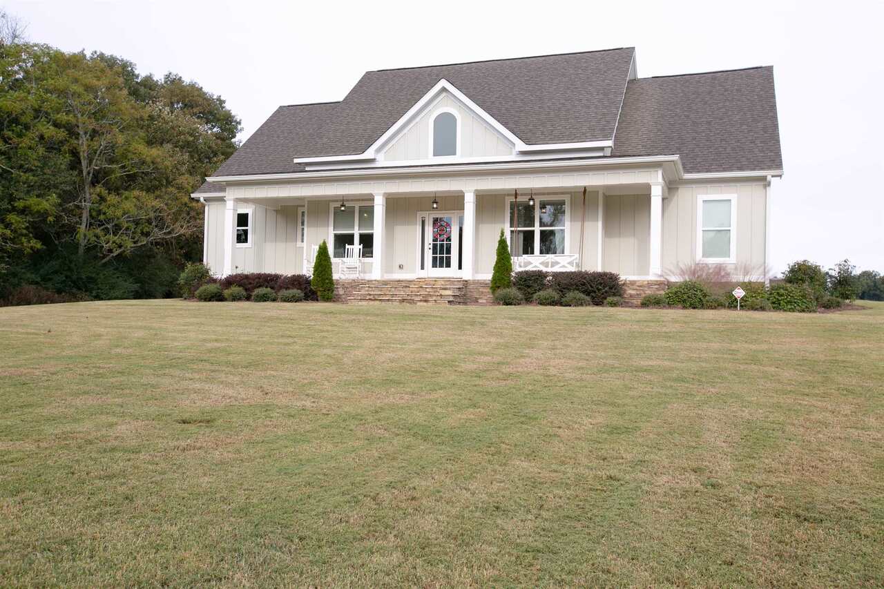 884 Smith Mill Road, Unit 4B Winder, GA 30680 - Photo 1 of 1 a front view of a house with a garden