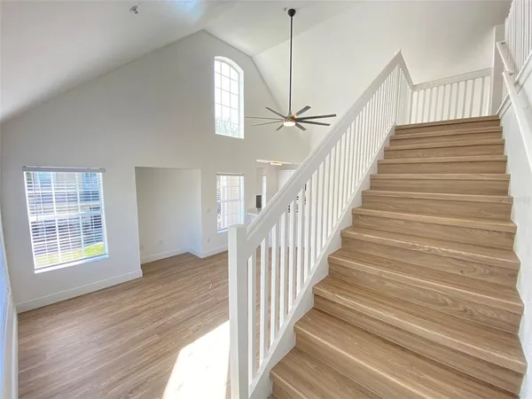a view of an entryway with wooden floor