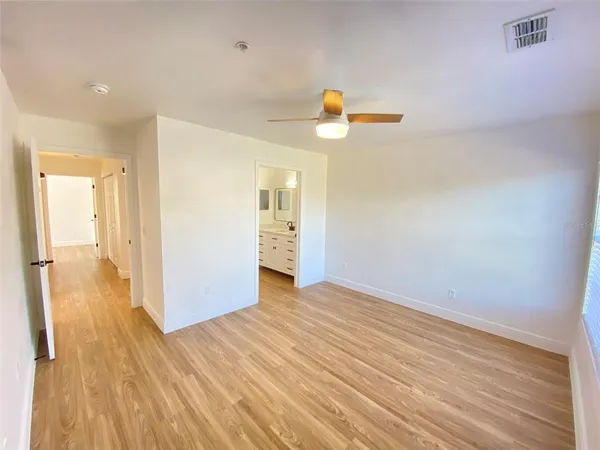 a view of a storage & utility room with wooden floor