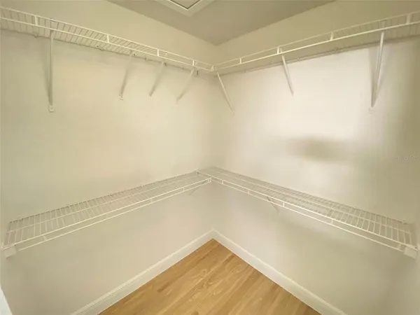 a view of a room with an empty walk in closet