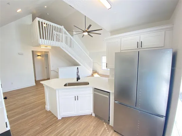 a kitchen with a refrigerator a sink and dishwasher