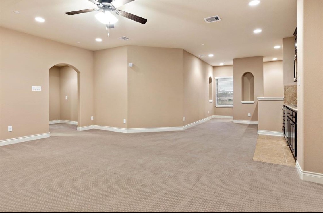 9039 Centennial Drive Conroe, TX 77384 - Photo 10 of 16 an empty room with fan and entrance