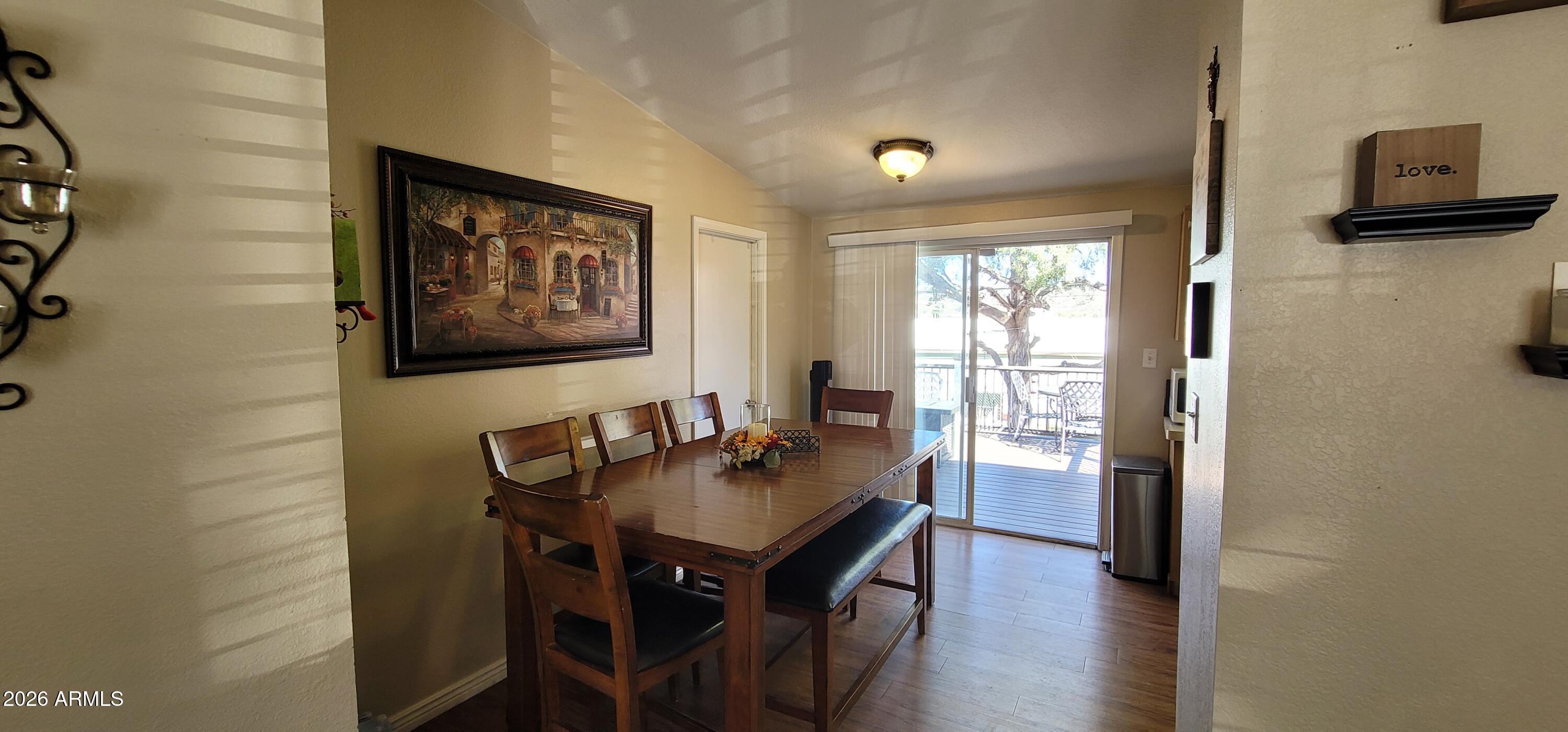 112 East Pine Street Payson, AZ 85541 - Photo 12 of 58 a view of a dining room with furniture and wooden floor