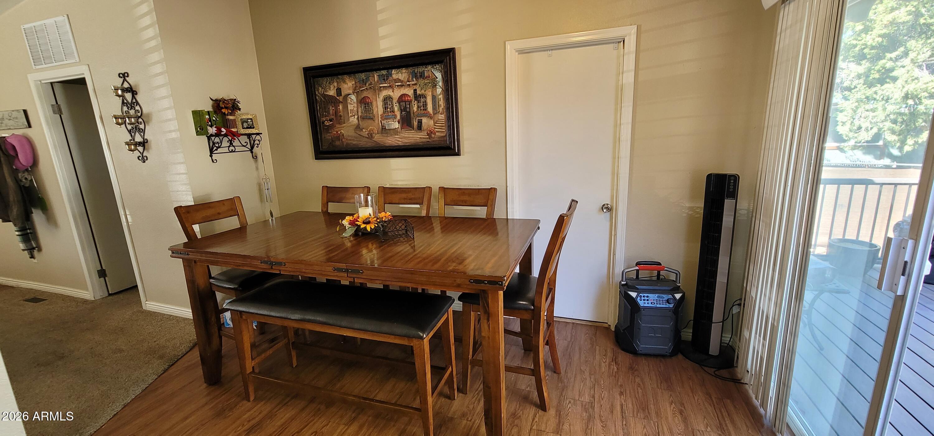 112 East Pine Street Payson, AZ 85541 - Photo 13 of 58 a view of a dining room with furniture and wooden floor