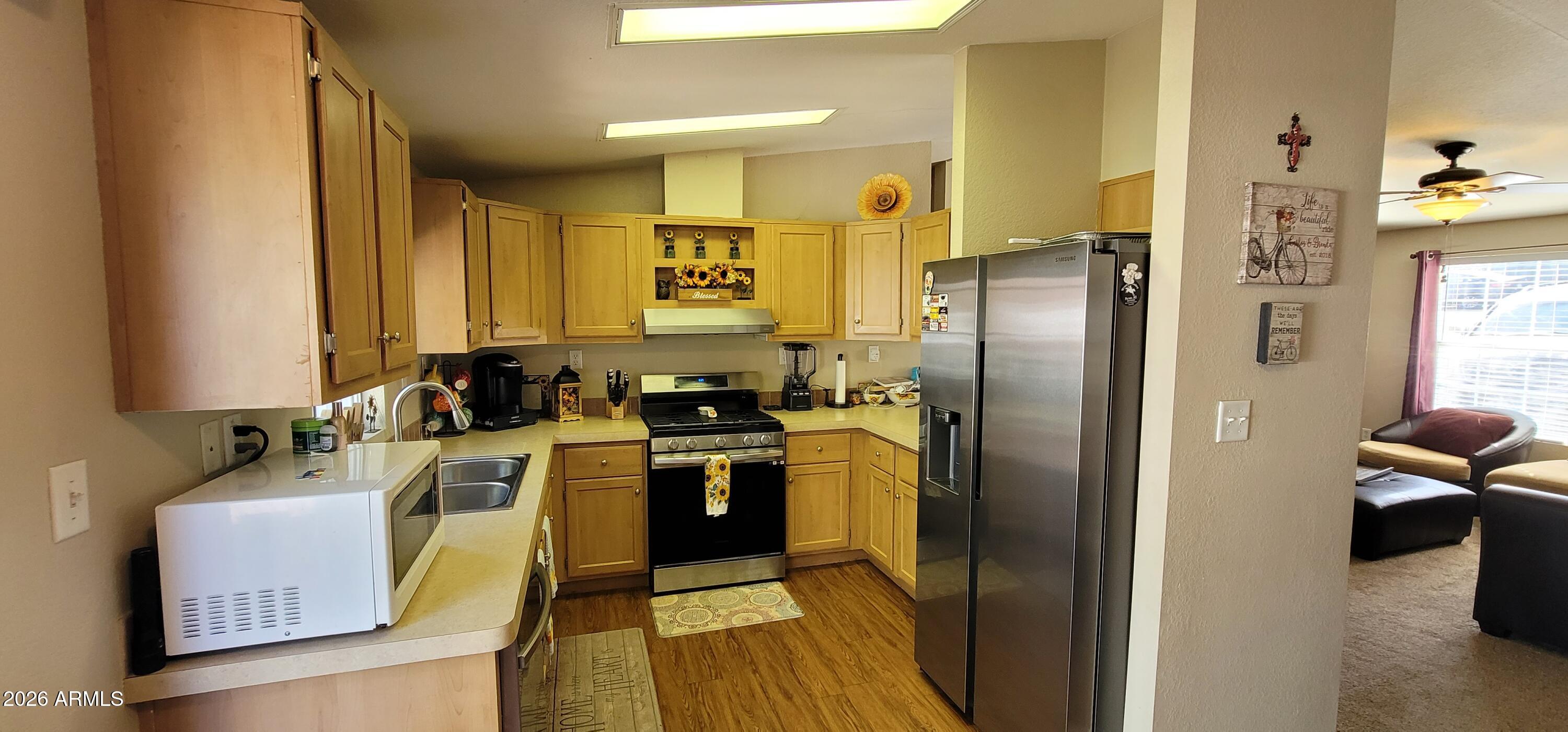 112 East Pine Street Payson, AZ 85541 - Photo 15 of 58 a kitchen with stainless steel appliances granite countertop a refrigerator and a sink