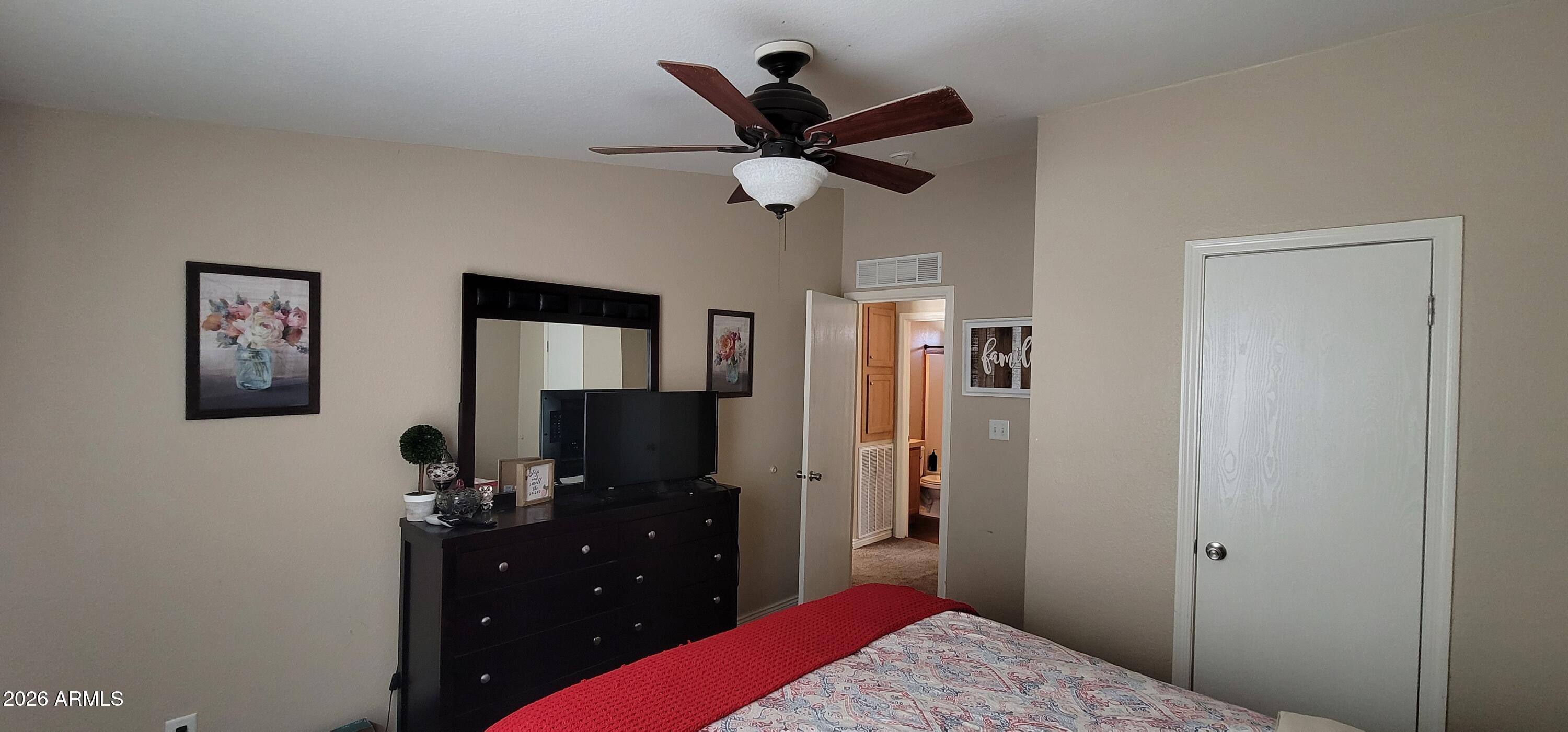 112 East Pine Street Payson, AZ 85541 - Photo 28 of 58 a bedroom with a bed and a flat screen tv