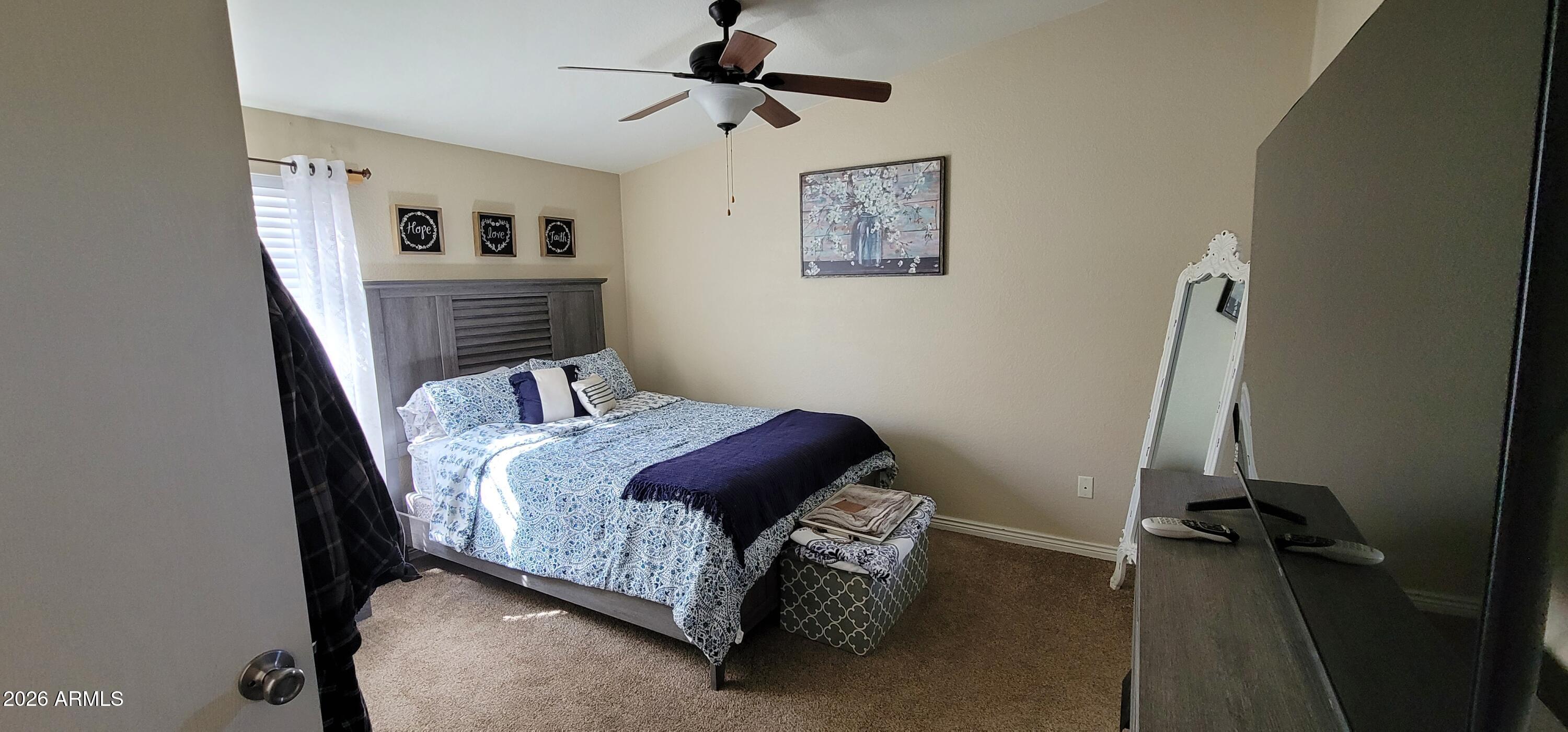 112 East Pine Street Payson, AZ 85541 - Photo 29 of 58 a bedroom with a bed and a desk
