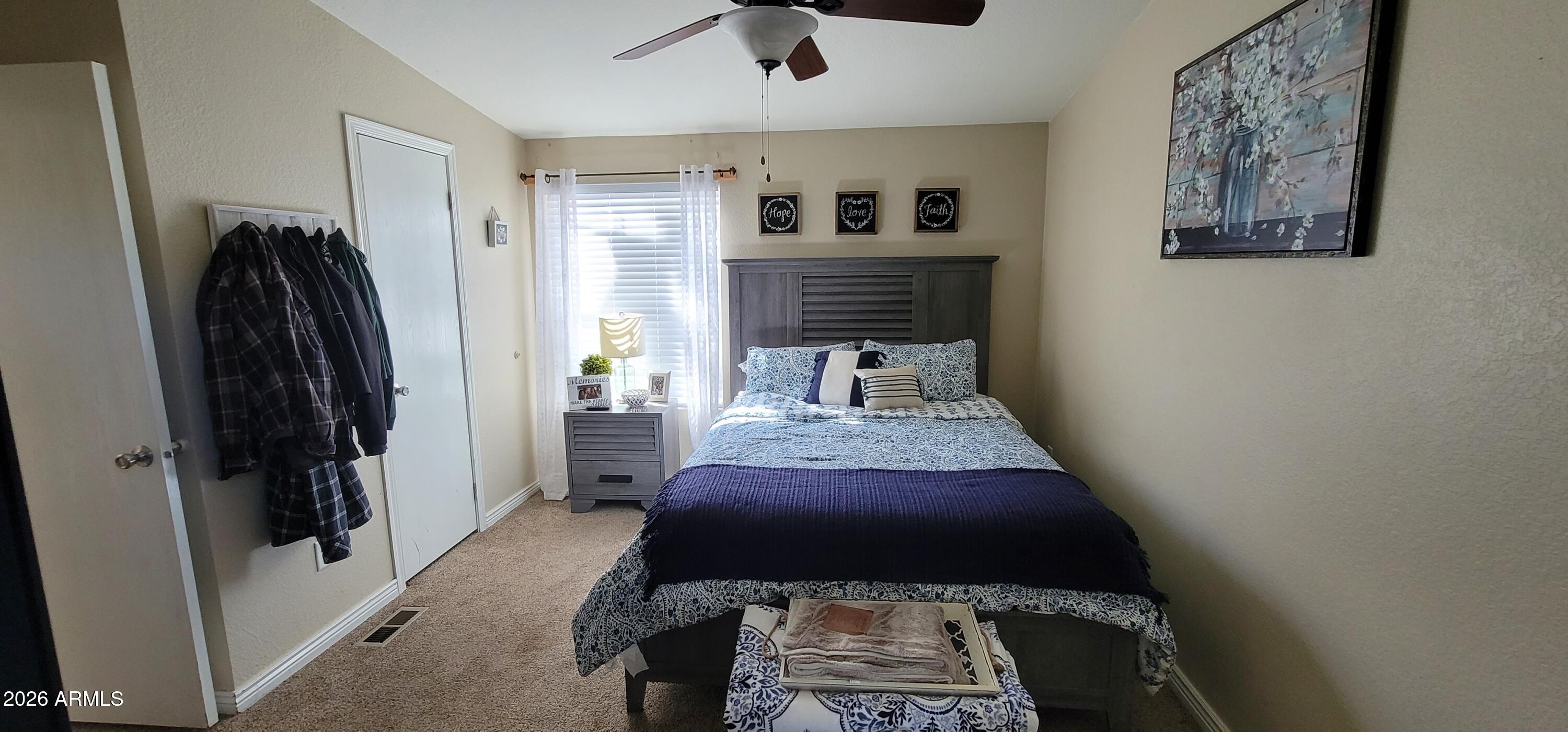 112 East Pine Street Payson, AZ 85541 - Photo 30 of 58 a bedroom with a bed and a rug