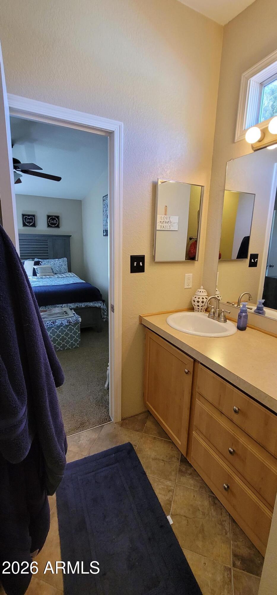 112 East Pine Street Payson, AZ 85541 - Photo 37 of 58 a bathroom with a sink and a mirror
