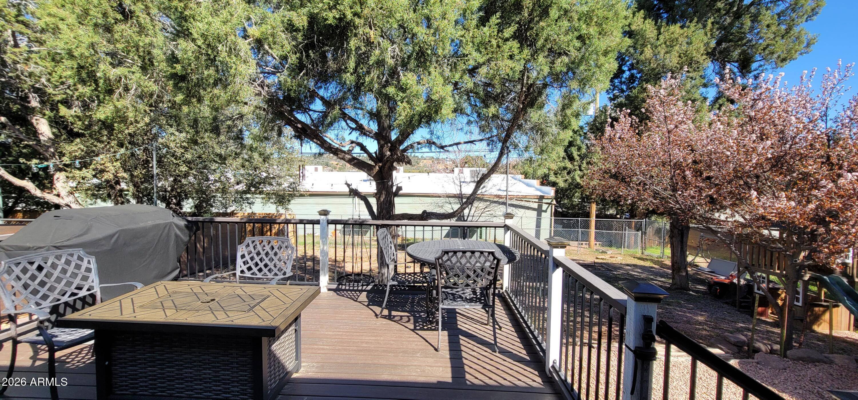 112 East Pine Street Payson, AZ 85541 - Photo 39 of 58 a view of a roof deck with furniture and trees