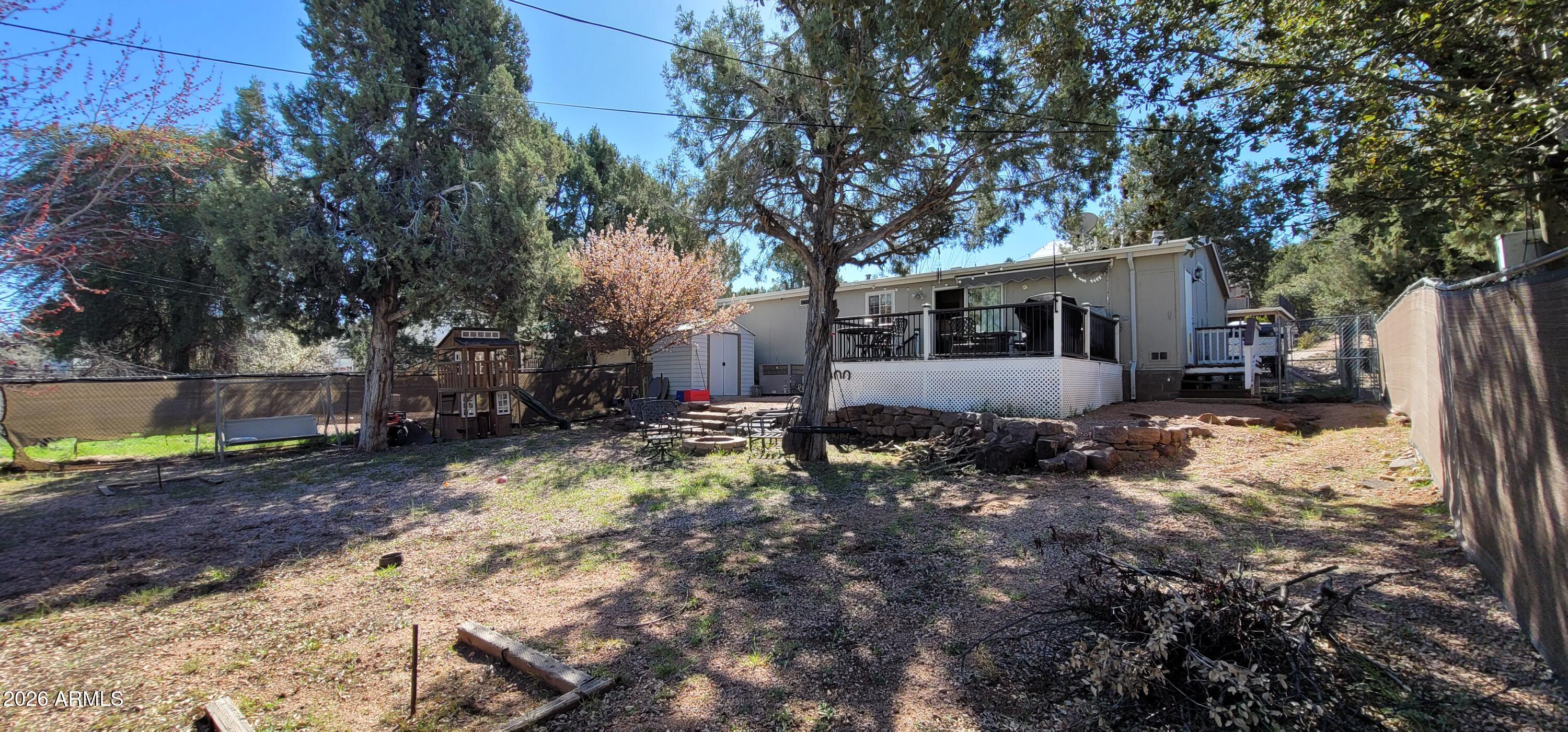 112 East Pine Street Payson, AZ 85541 - Photo 49 of 58 a backyard of a house with barbeque oven and outdoor seating