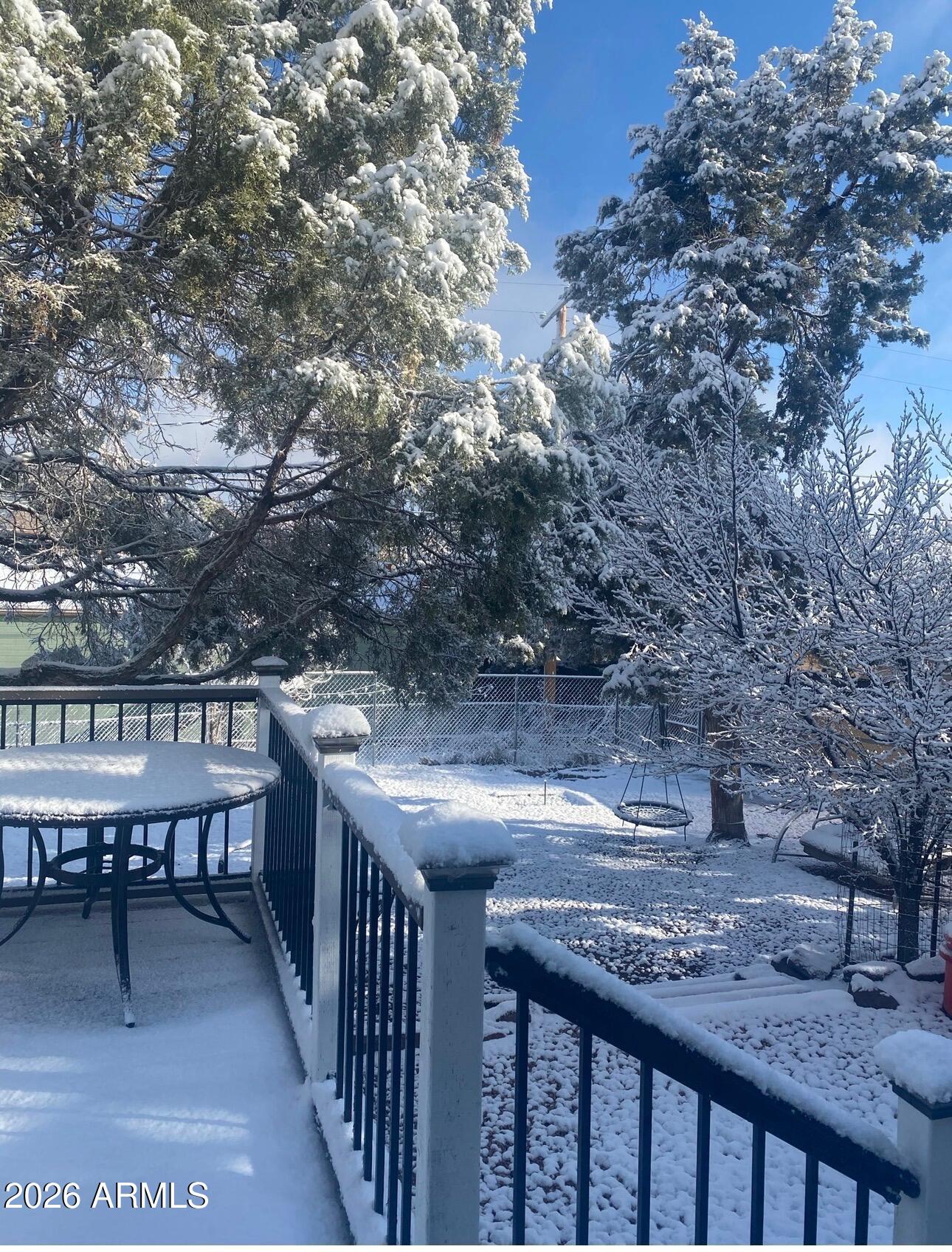 112 East Pine Street Payson, AZ 85541 - Photo 5 of 58 a view of a chairs and table on the deck