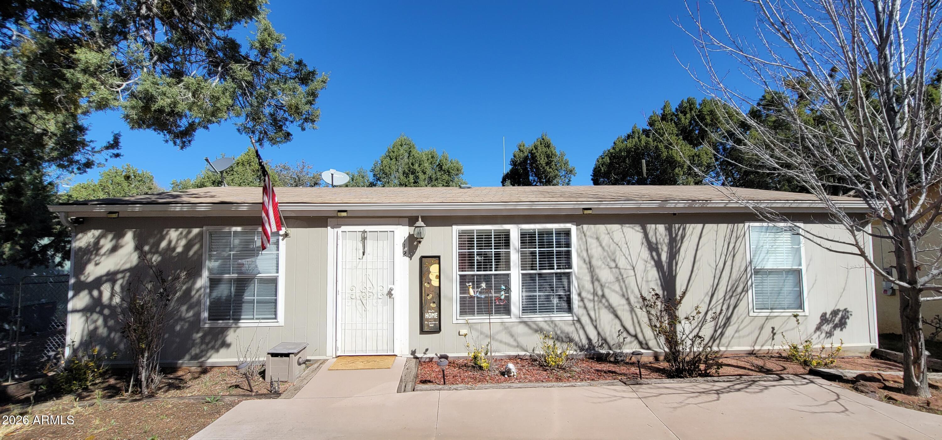 112 East Pine Street Payson, AZ 85541 - Photo 51 of 58 a front view of a house with a tree