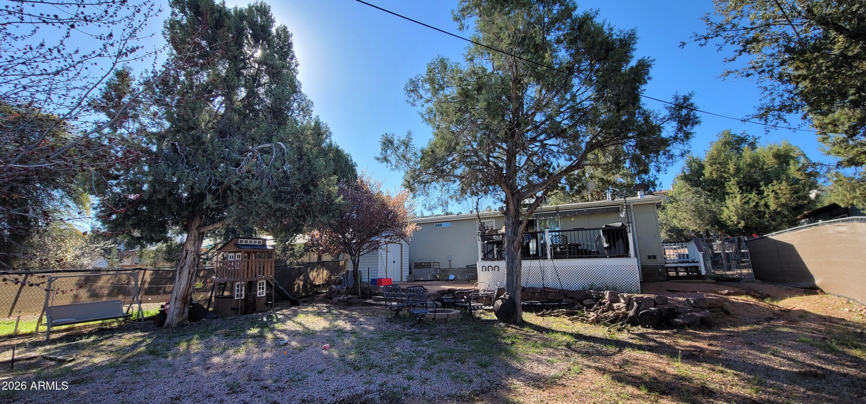 112 East Pine Street Payson, AZ 85541 - Photo 54 of 58 a backyard of a house with barbeque oven and outdoor seating
