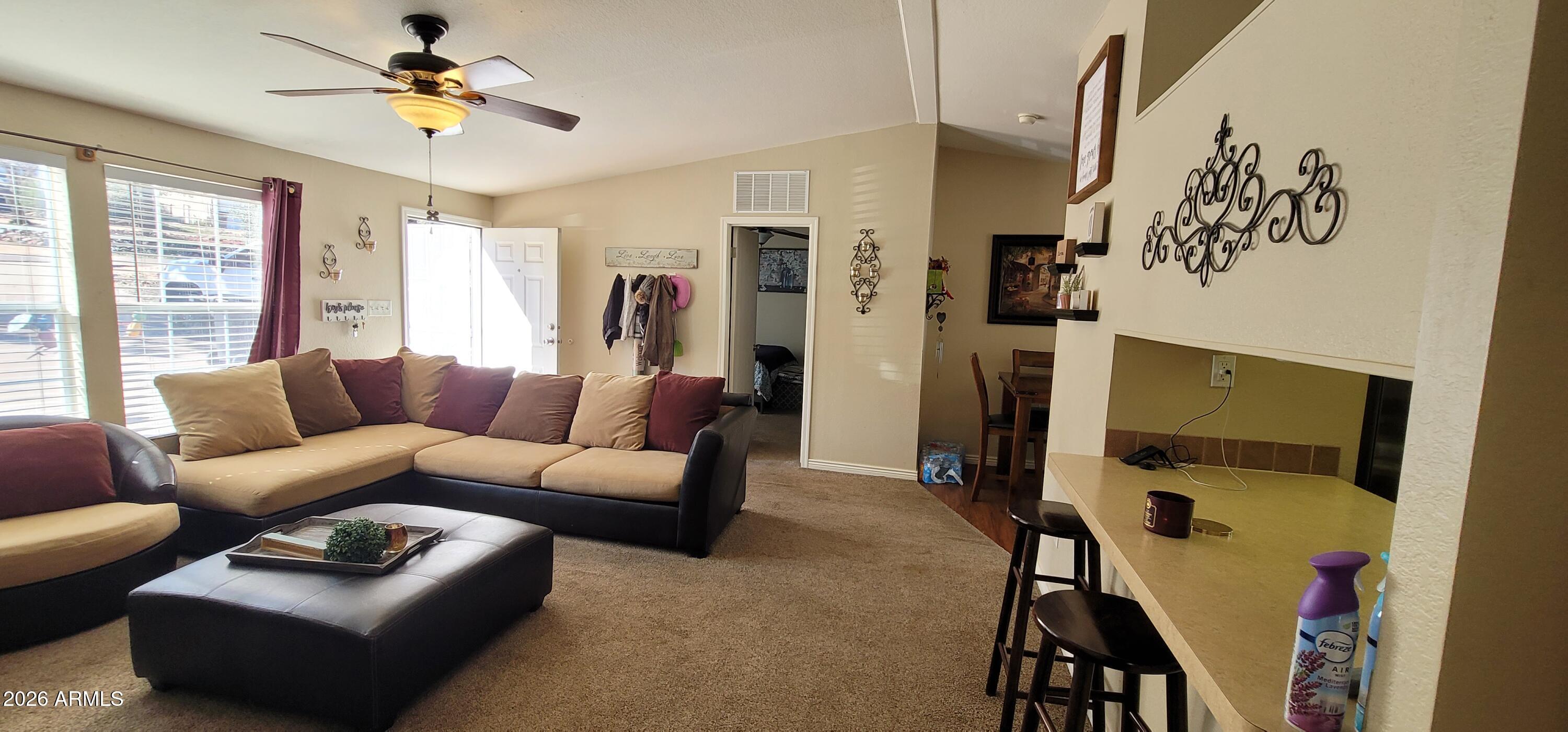 112 East Pine Street Payson, AZ 85541 - Photo 6 of 58 a living room with furniture ceiling fan and a window
