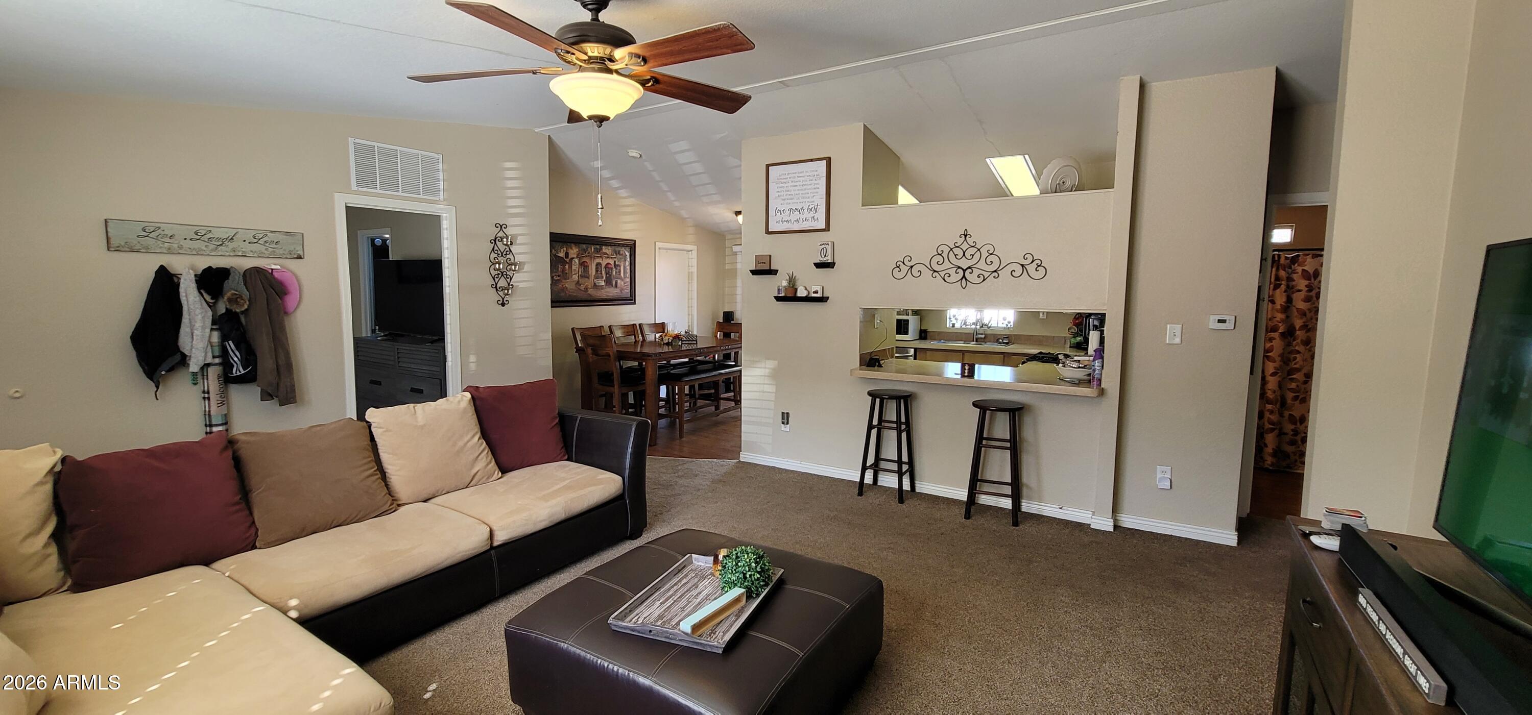 112 East Pine Street Payson, AZ 85541 - Photo 7 of 58 a living room with furniture and a chandelier