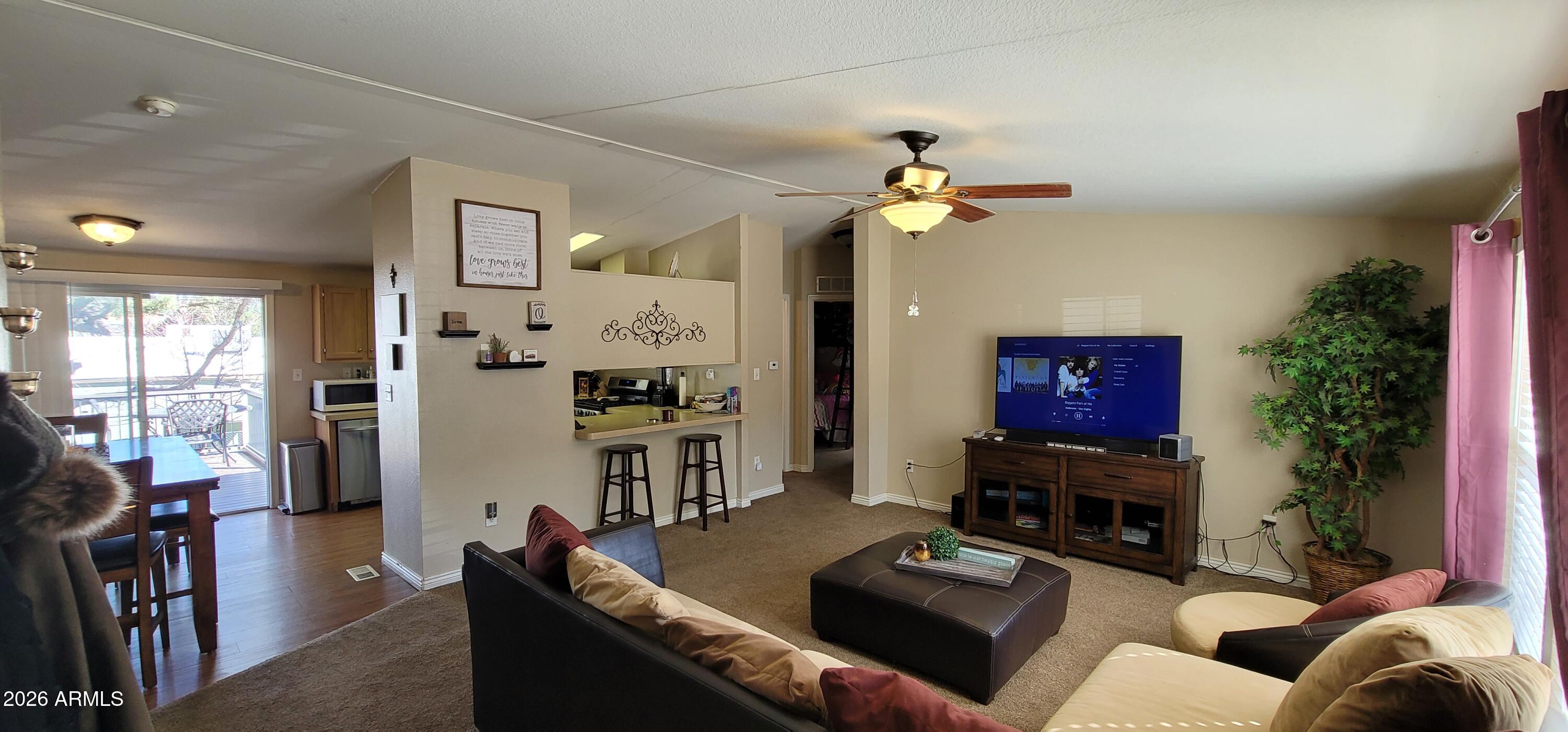 112 East Pine Street Payson, AZ 85541 - Photo 8 of 58 a living room with furniture and a flat screen tv