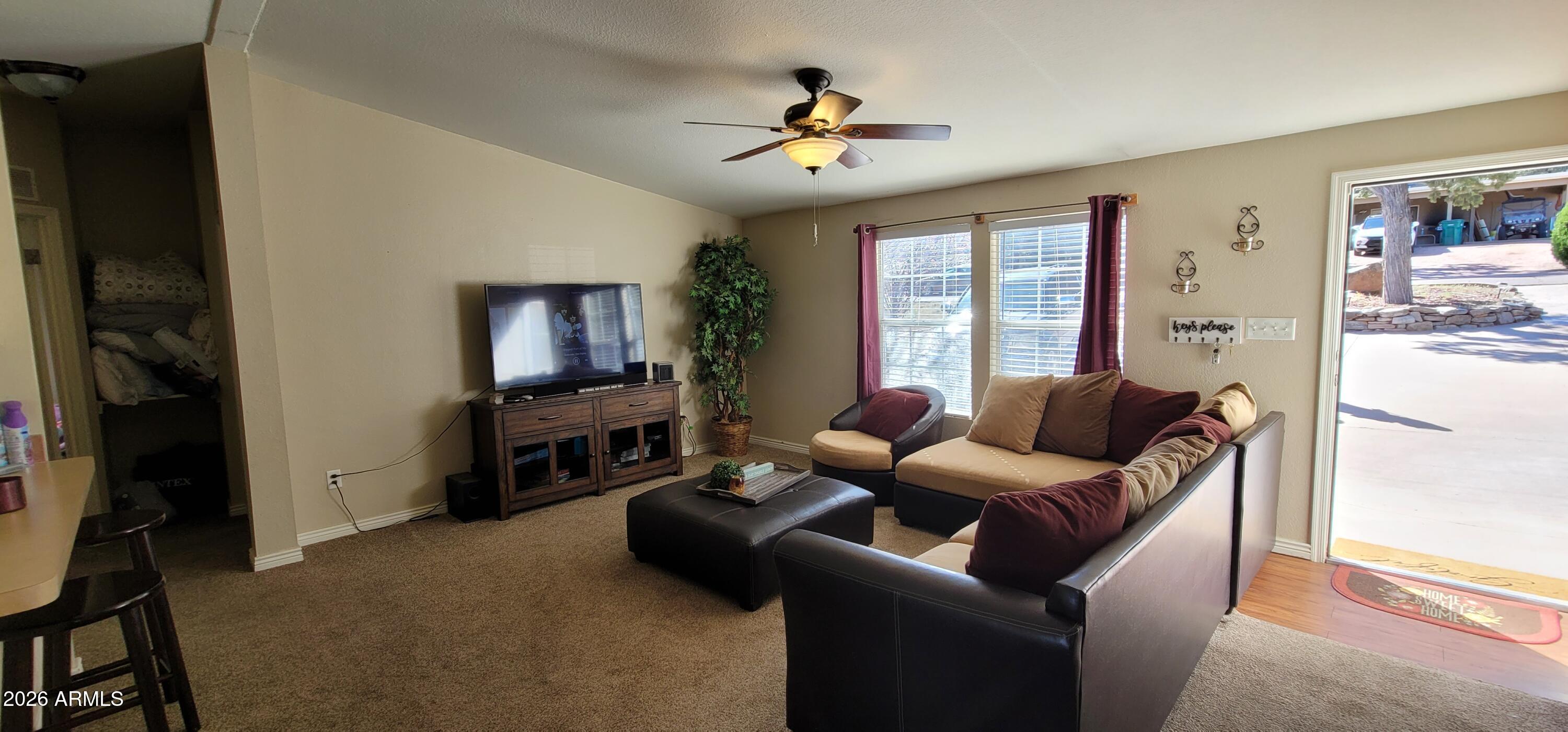 112 East Pine Street Payson, AZ 85541 - Photo 9 of 58 a living room with furniture and a flat screen tv