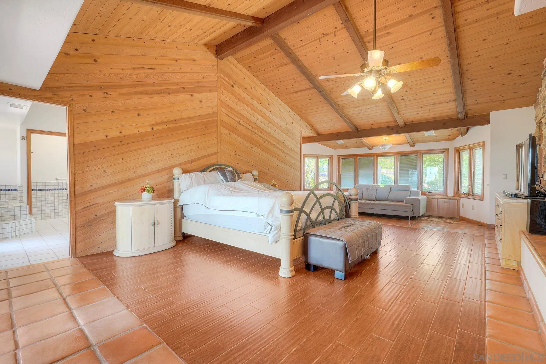 30458 Cool Valley Highlands Road Valley Center, CA 92082 - Photo 35 of 47 a bedroom with furniture and a wooden floor