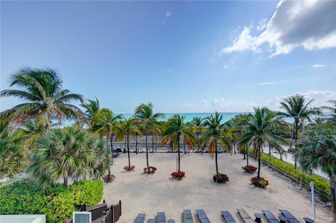 9201 Collins Avenue, Unit 326 Surfside, FL 33154 - Photo 1 of 41 a view of outdoor space with palm trees