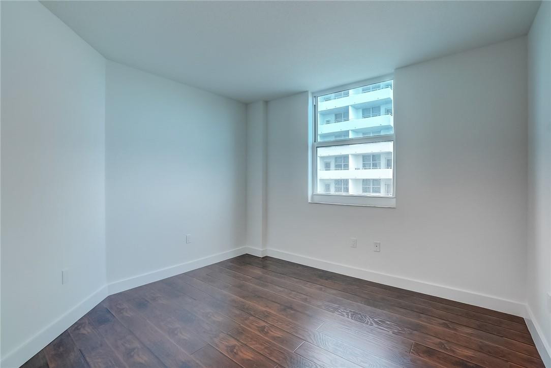 9201 Collins Avenue, Unit 326 Surfside, FL 33154 - Photo 14 of 41 wooden floor in an empty room with a window