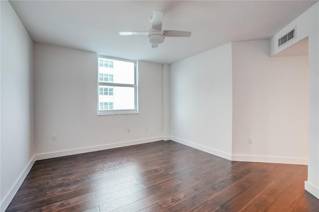 9201 Collins Avenue, Unit 326 Surfside, FL 33154 - Photo 20 of 41 wooden floor in an empty room with a window