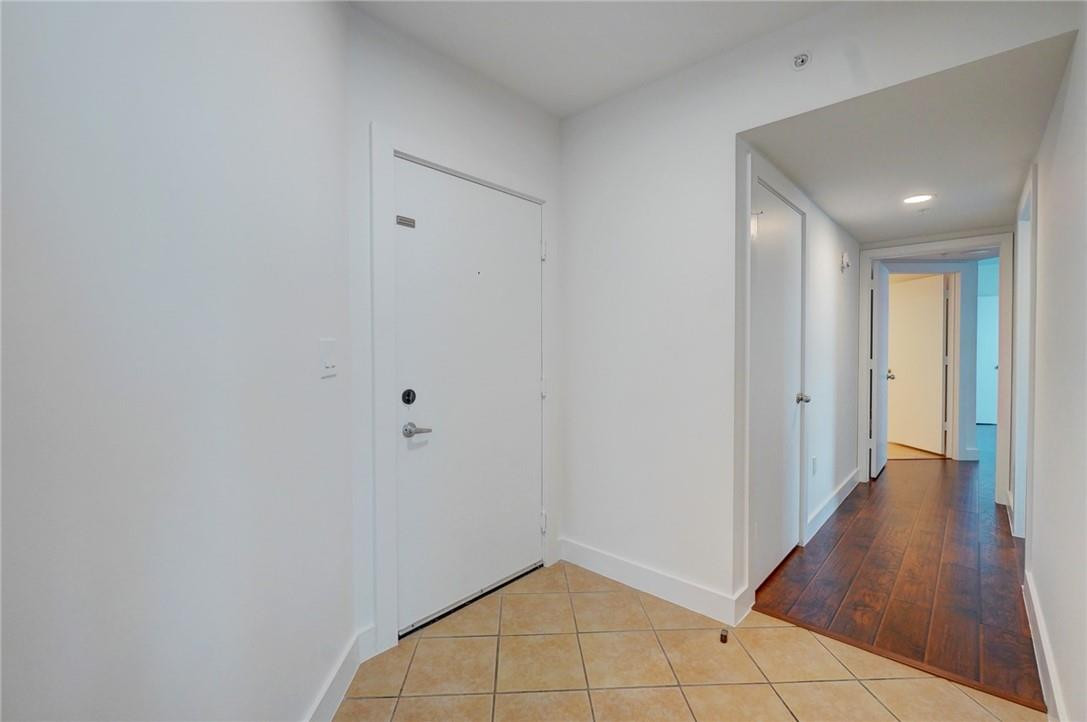 9201 Collins Avenue, Unit 326 Surfside, FL 33154 - Photo 2 of 41 a view of an empty room with wooden floor