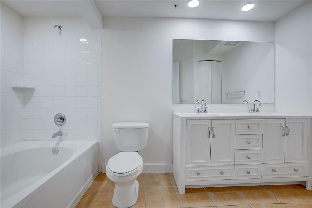 9201 Collins Avenue, Unit 326 Surfside, FL 33154 - Photo 21 of 41 a bathroom with a sink a toilet and bathtub