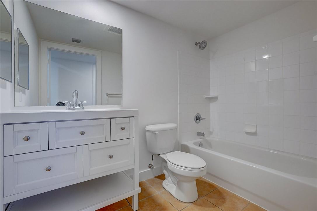 9201 Collins Avenue, Unit 326 Surfside, FL 33154 - Photo 23 of 41 a bathroom with a toilet sink and bathtub